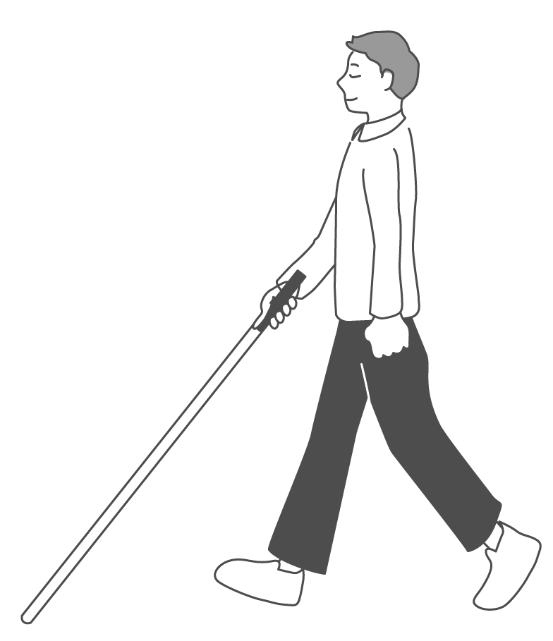 白杖を持って歩く人